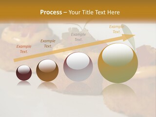 A White Plate Topped With Mini Cakes Covered In Toppings PowerPoint Template