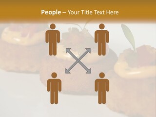 A White Plate Topped With Mini Cakes Covered In Toppings PowerPoint Template