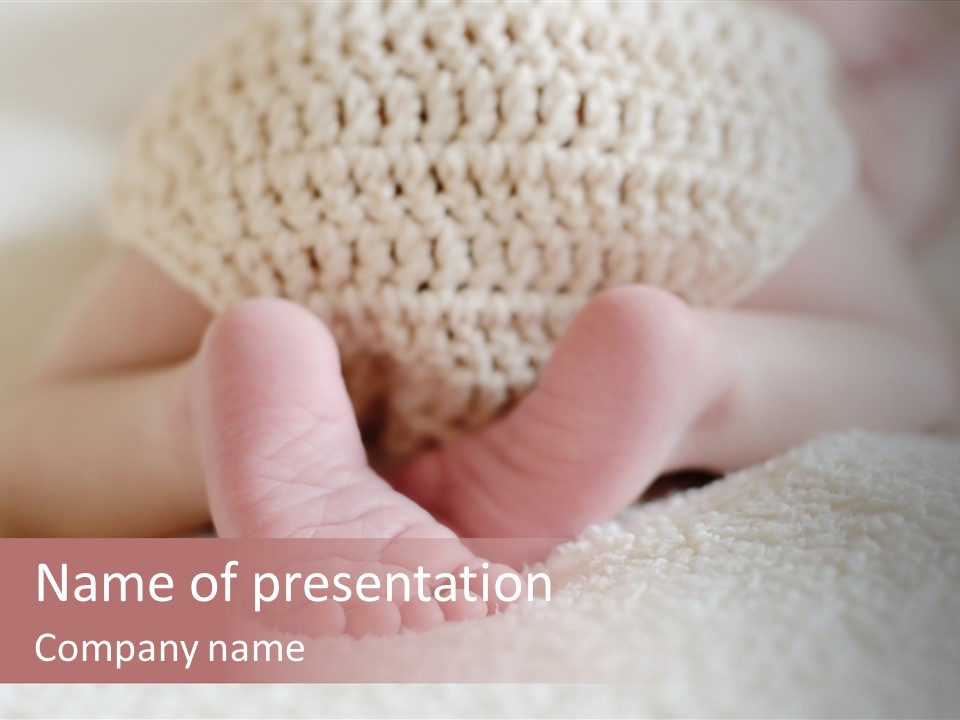 A Baby Is Laying Down With A Hat On His Head PowerPoint Template