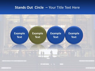 A Group Of People Standing In Front Of A Building PowerPoint Template