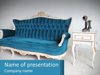 A Blue Couch Sitting Next To A White Table PowerPoint Template