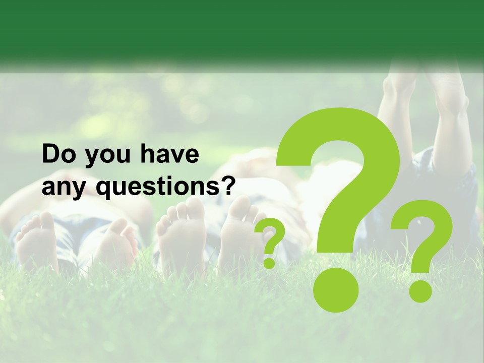 A Group Of People Laying On Top Of A Lush Green Field PowerPoint Template