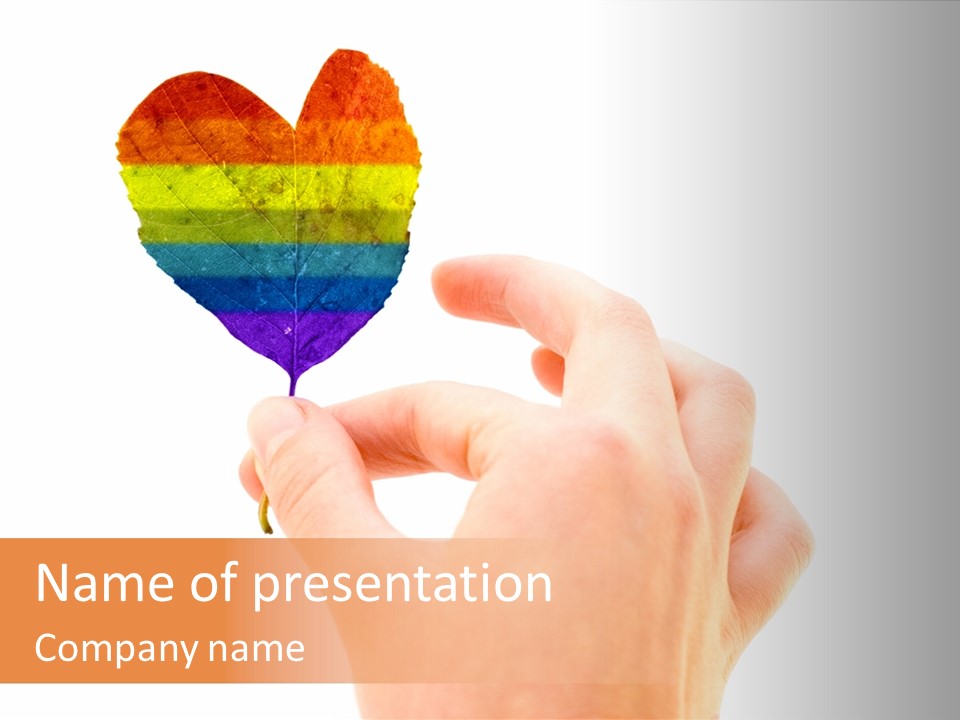 A Person Holding A Colorful Heart Shaped Leaf PowerPoint Template