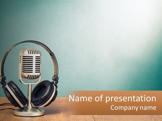 A Microphone And Headphones On A Wooden Table PowerPoint Template