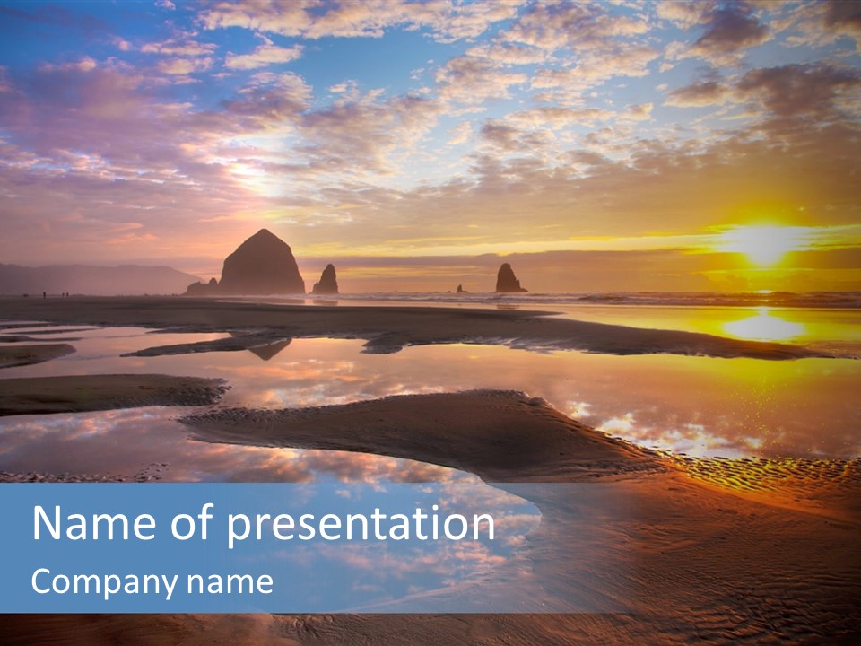 A Beautiful Sunset Over The Ocean With Rocks In The Background PowerPoint Template