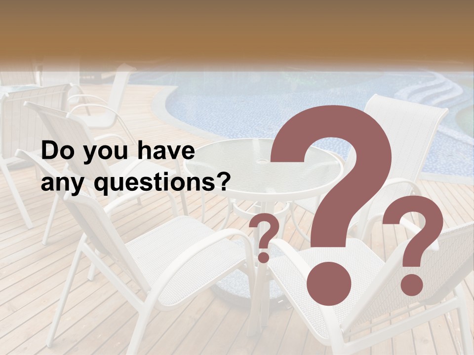 A Table And Chairs Near A Swimming Pool PowerPoint Template