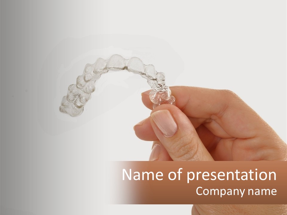 A Person Holding A Toothbrush In Their Hand PowerPoint Template