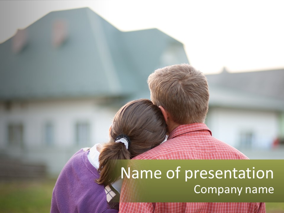 A Young Boy And A Young Girl Hugging In Front Of A House PowerPoint Template
