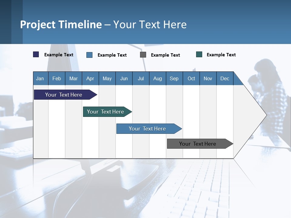 A Man Sitting In Front Of A Computer Monitor PowerPoint Template