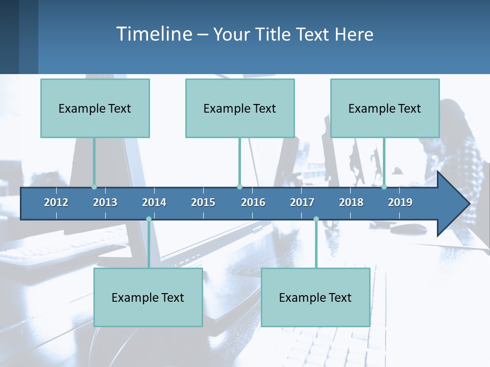A Man Sitting In Front Of A Computer Monitor PowerPoint Template
