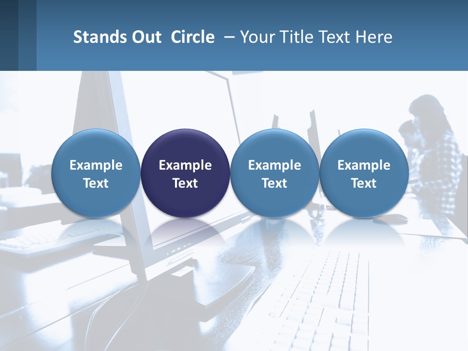 A Man Sitting In Front Of A Computer Monitor PowerPoint Template