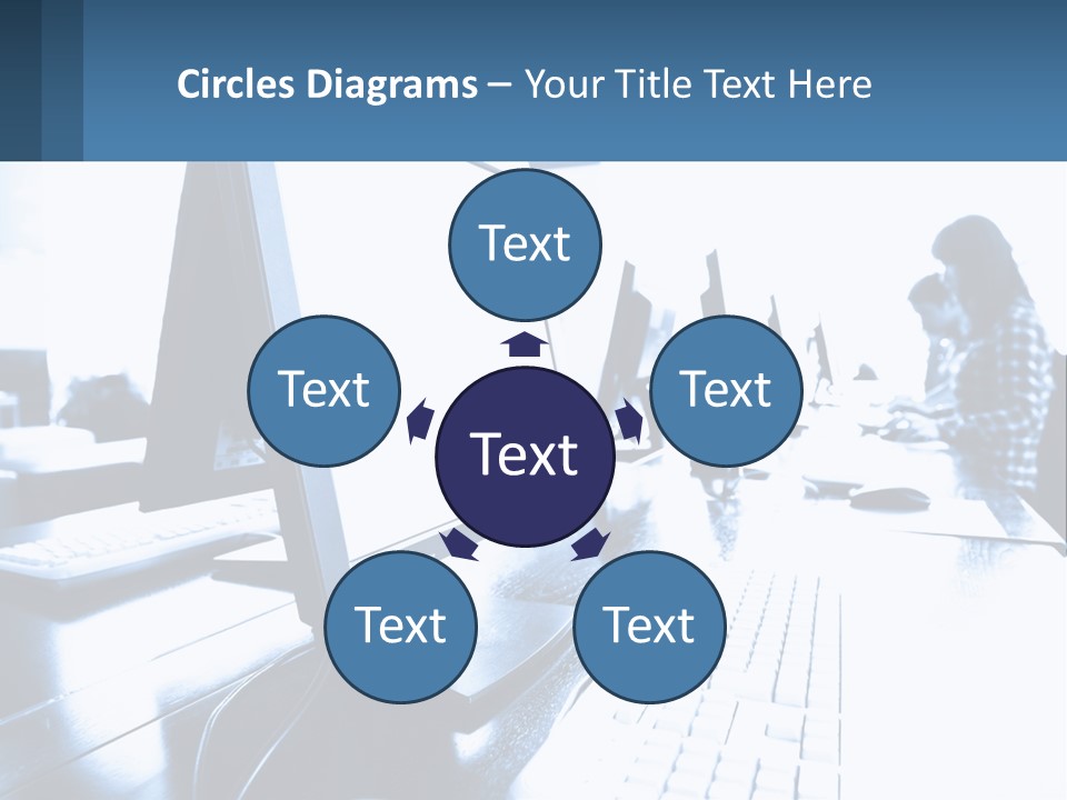 A Man Sitting In Front Of A Computer Monitor PowerPoint Template