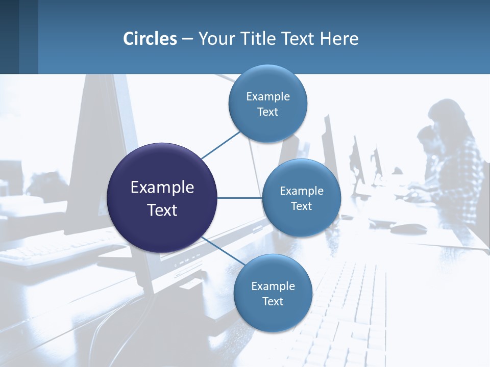A Man Sitting In Front Of A Computer Monitor PowerPoint Template