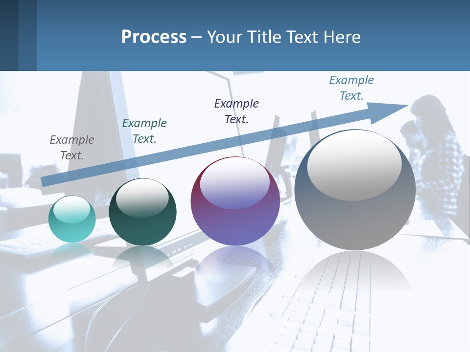 A Man Sitting In Front Of A Computer Monitor PowerPoint Template