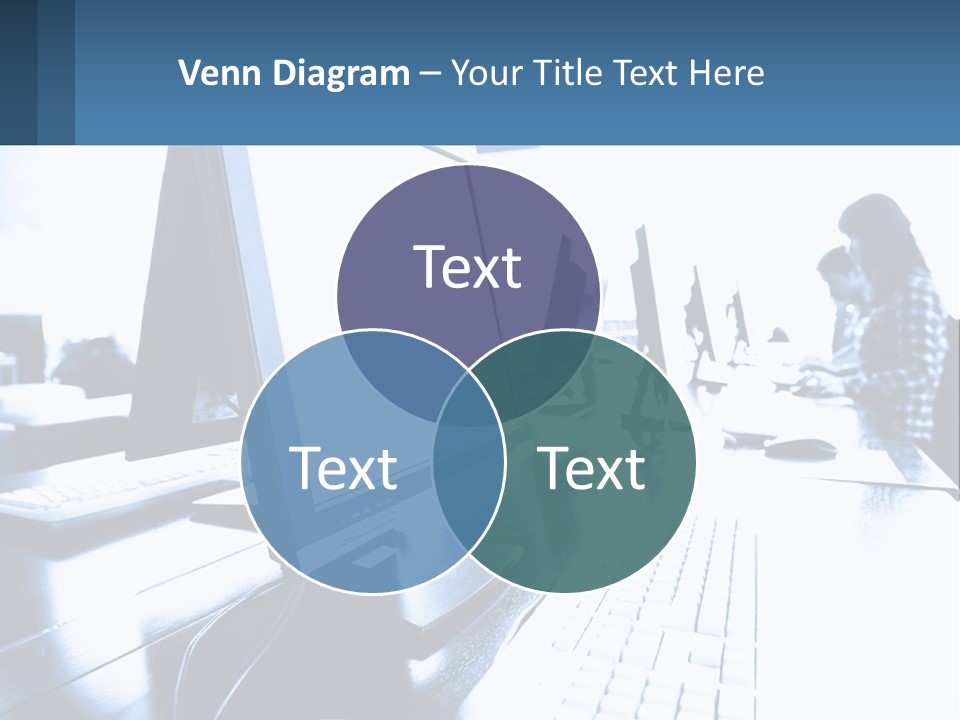 A Man Sitting In Front Of A Computer Monitor PowerPoint Template