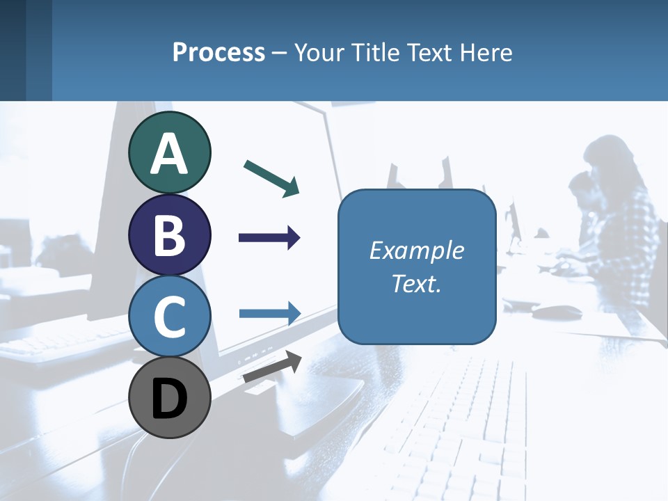A Man Sitting In Front Of A Computer Monitor PowerPoint Template