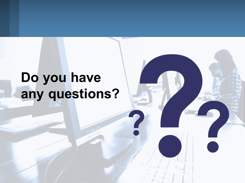 A Man Sitting In Front Of A Computer Monitor PowerPoint Template