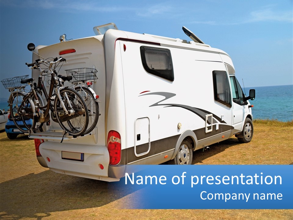 A Motor Home With Bicycles On The Back Of It PowerPoint Template