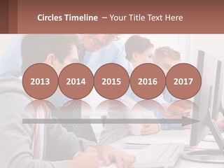 A Group Of People Working On A Computer PowerPoint Template