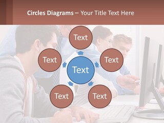 A Group Of People Working On A Computer PowerPoint Template