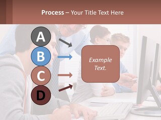 A Group Of People Working On A Computer PowerPoint Template
