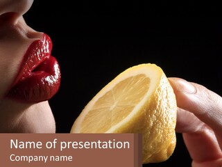 A Person Holding A Slice Of Lemon In Their Hand PowerPoint Template