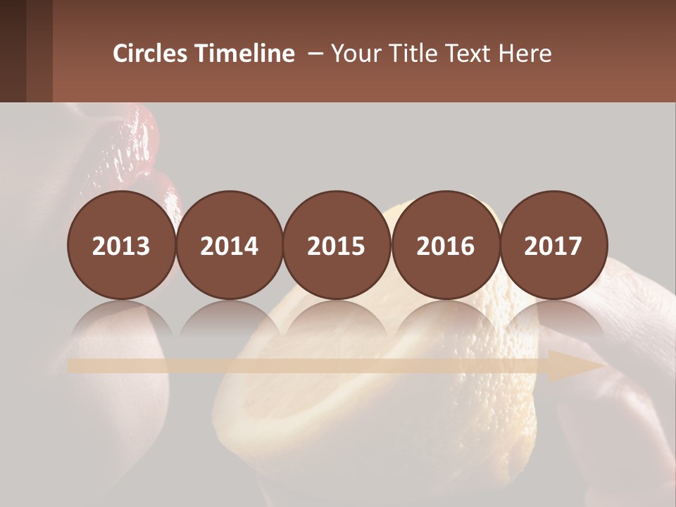 A Person Holding A Slice Of Lemon In Their Hand PowerPoint Template