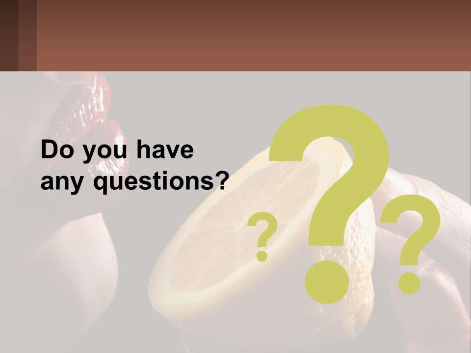 A Person Holding A Slice Of Lemon In Their Hand PowerPoint Template