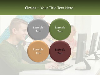 A Group Of People Sitting At A Computer Desk PowerPoint Template