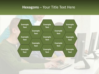 A Group Of People Sitting At A Computer Desk PowerPoint Template