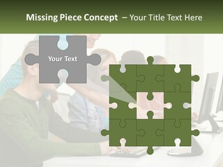 A Group Of People Sitting At A Computer Desk PowerPoint Template