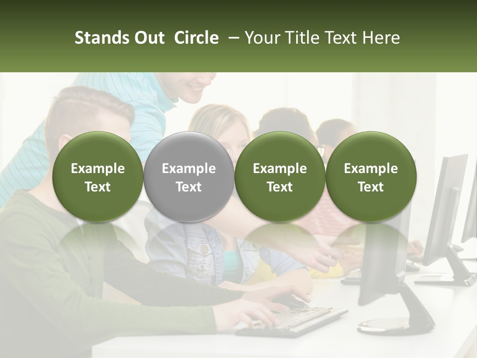A Group Of People Sitting At A Computer Desk PowerPoint Template