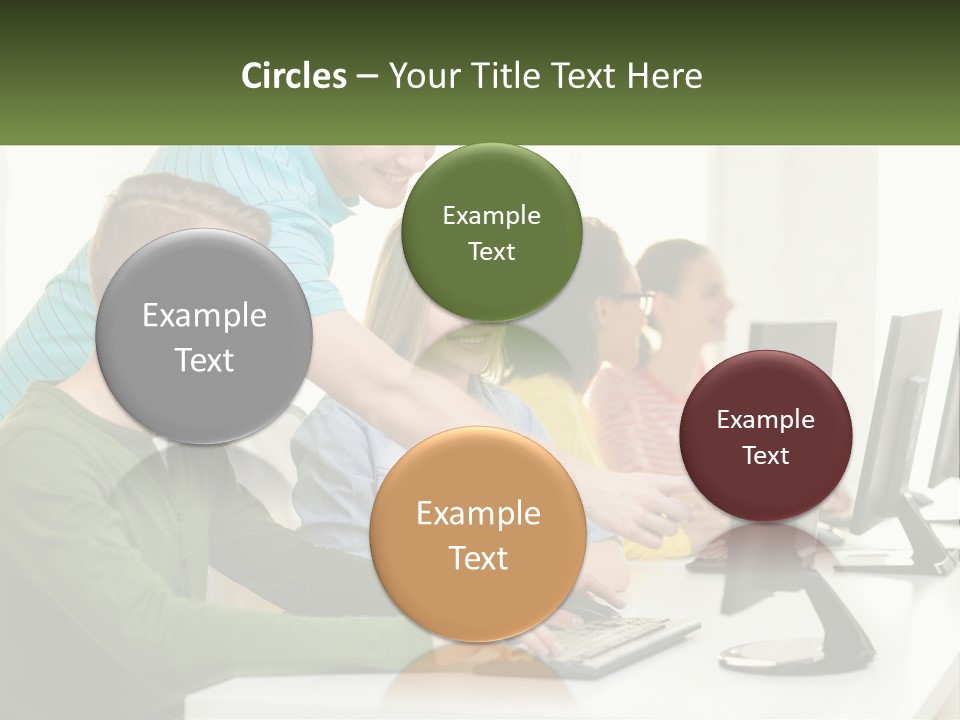 A Group Of People Sitting At A Computer Desk PowerPoint Template