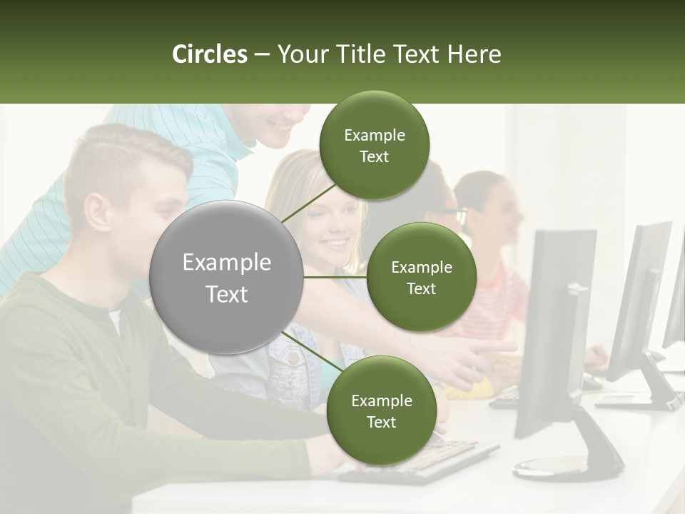 A Group Of People Sitting At A Computer Desk PowerPoint Template