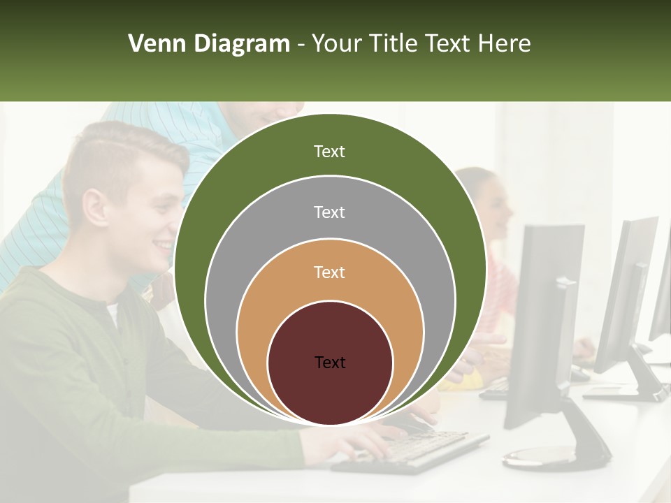A Group Of People Sitting At A Computer Desk PowerPoint Template