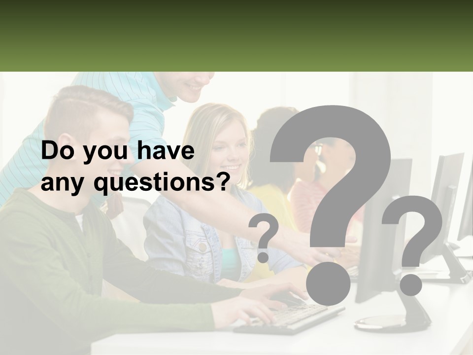 A Group Of People Sitting At A Computer Desk PowerPoint Template