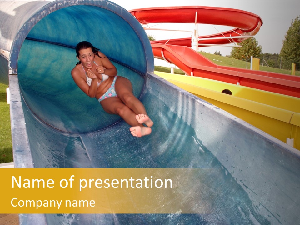 A Woman Slides Down A Slide In A Water Park PowerPoint Template