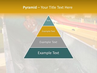 A Woman Slides Down A Slide In A Water Park PowerPoint Template
