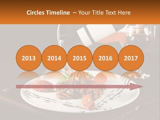 A Plate Of Food And A Glass Of Wine On A Table PowerPoint Template