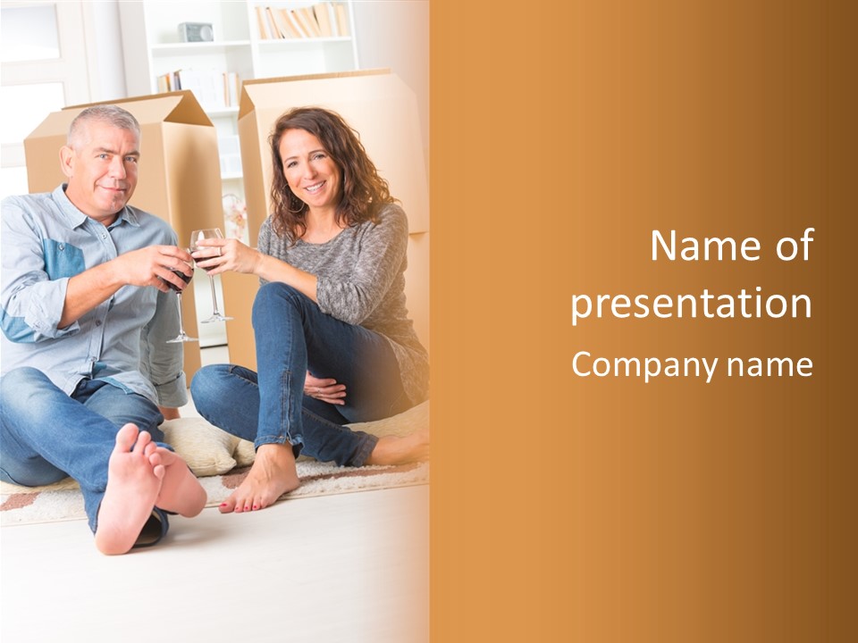 A Man And A Woman Sitting On The Floor With Boxes In The Background PowerPoint Template