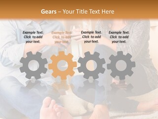 A Man And A Woman Sitting On The Floor With Boxes In The Background PowerPoint Template