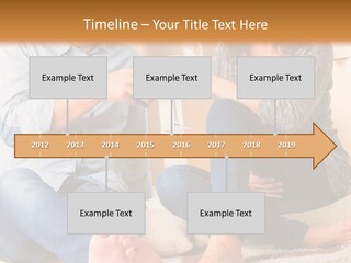 A Man And A Woman Sitting On The Floor With Boxes In The Background PowerPoint Template