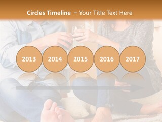 A Man And A Woman Sitting On The Floor With Boxes In The Background PowerPoint Template