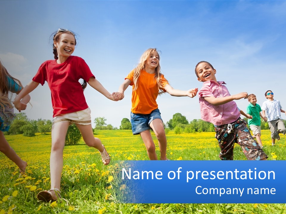 A Group Of Children Running Through A Field Holding Hands PowerPoint Template