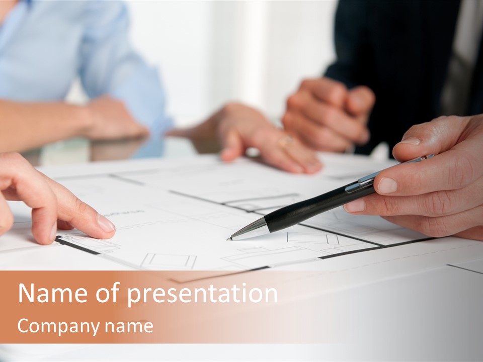 A Group Of People Sitting At A Table With A Pen And Paper PowerPoint Template