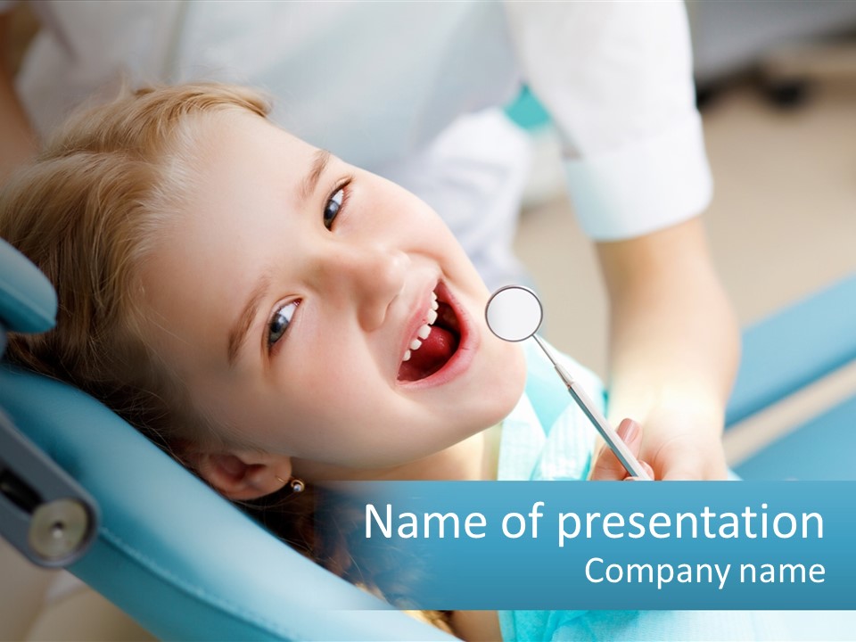 A Little Girl Is Smiling And Having Her Teeth Brushed PowerPoint Template
