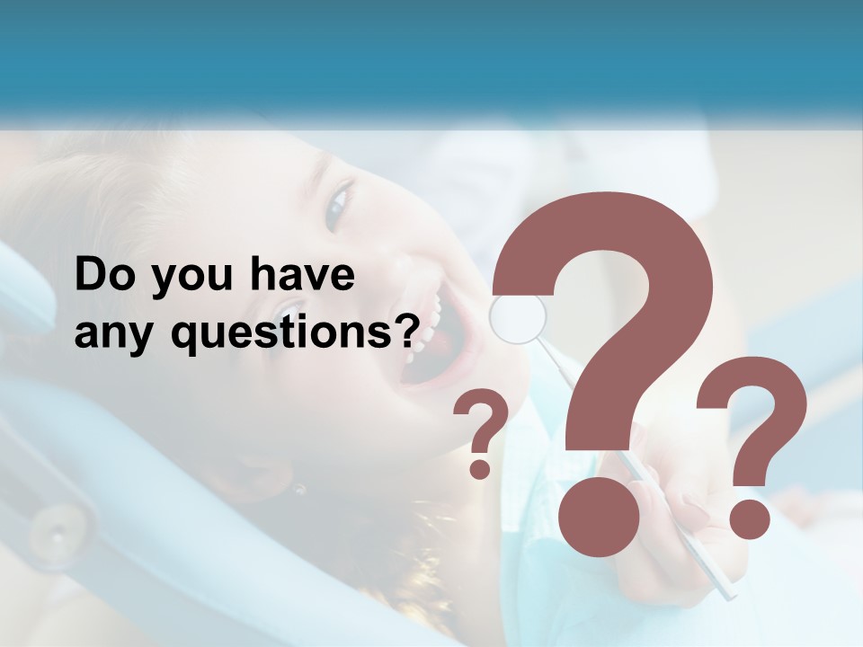 A Little Girl Is Smiling And Having Her Teeth Brushed PowerPoint Template