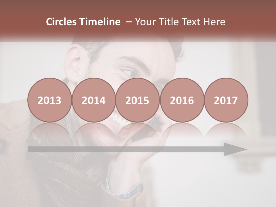 A Man Smiling While Talking On A Cell Phone PowerPoint Template