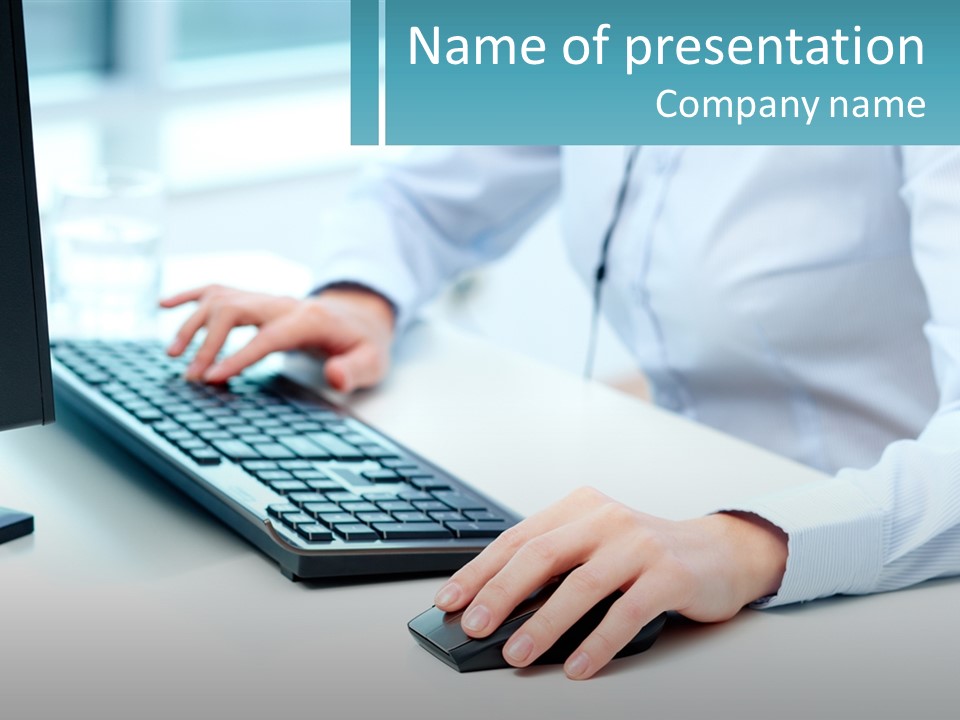 A Person Typing On A Computer Keyboard On A Desk PowerPoint Template