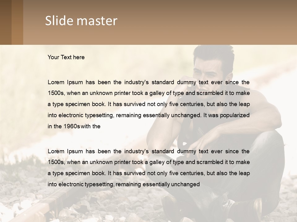 A Man Sitting On A Train Track Talking On A Cell Phone PowerPoint Template